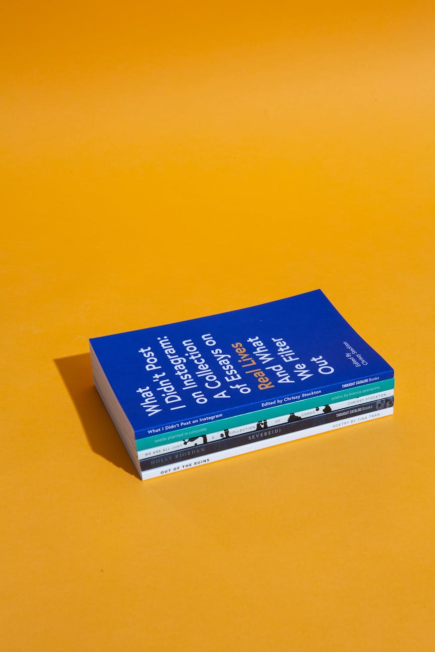 A stack of books with a bright orange background, perfect for educational themes.