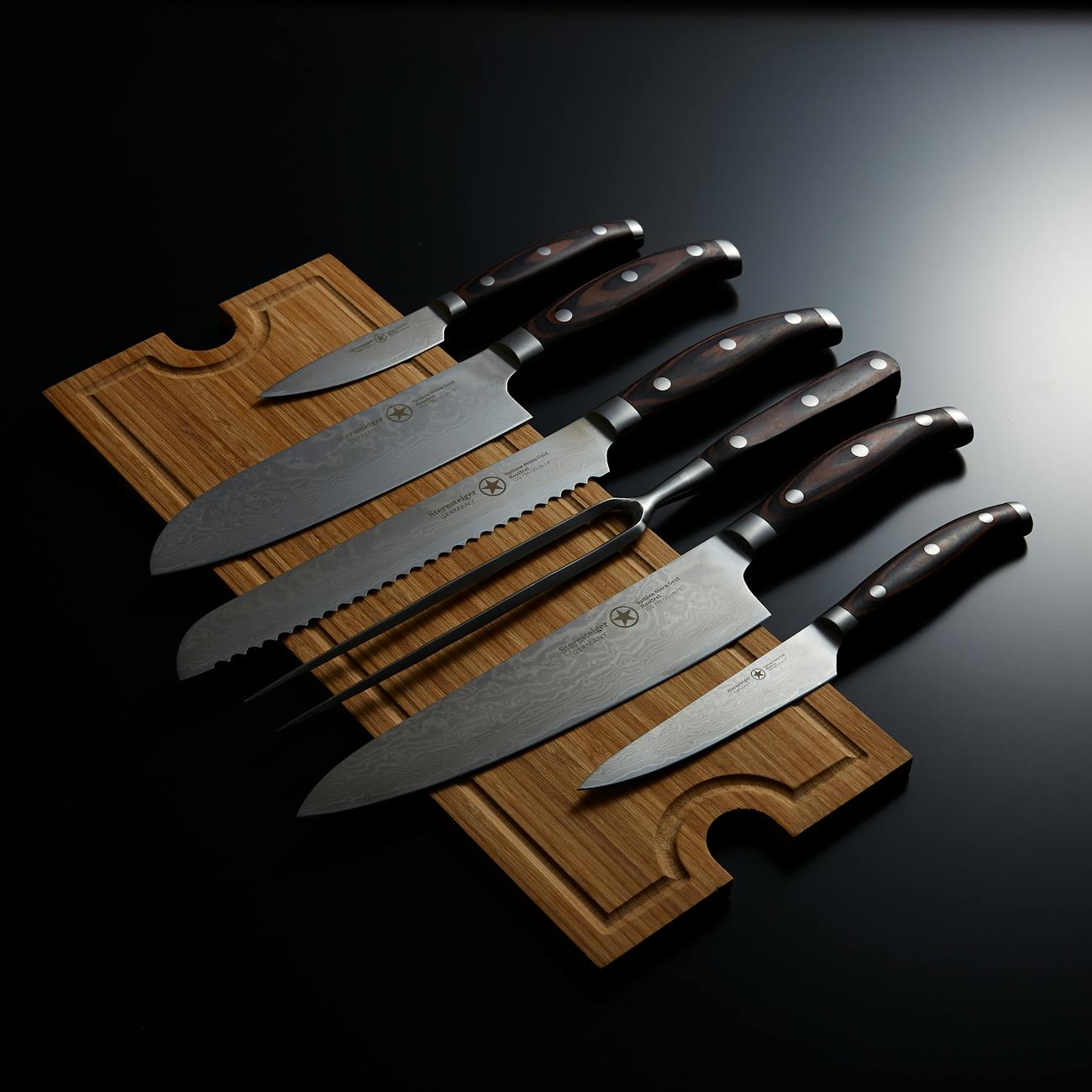 A set of high-quality kitchen knives displayed artfully on a wooden cutting board.