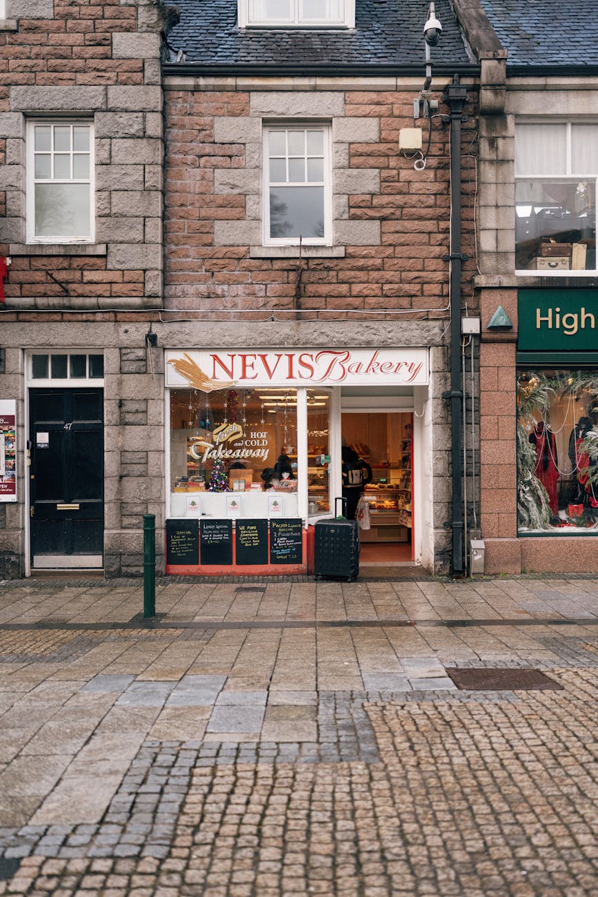 Front view of Nevis Bakery, showcasing cozy street scene in Fort William, Scotland.